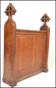 A 19th Century Victorian gothic ecclesiastical oak prayer desk panel flanked by shaped solid