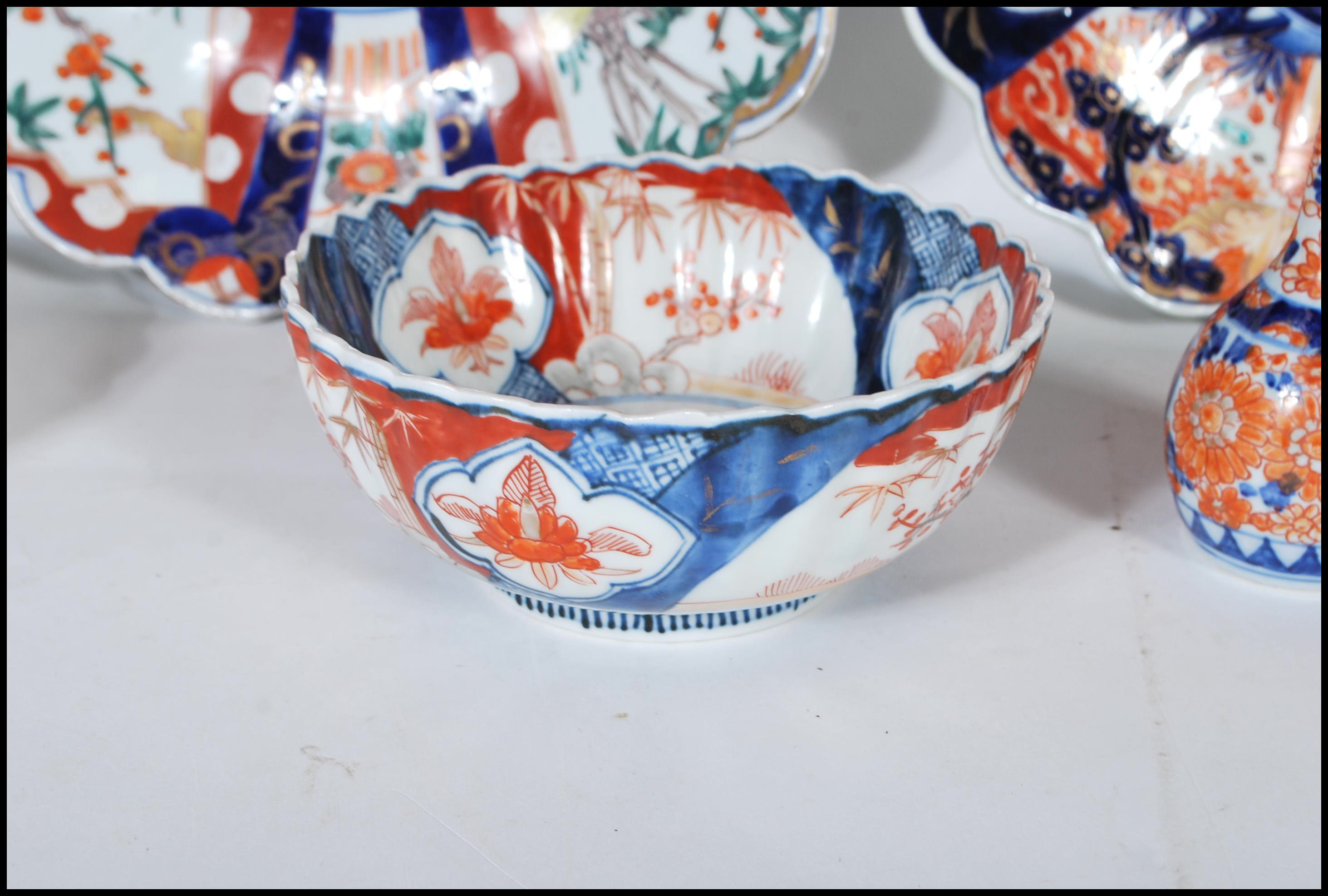 A collection of 20th Century Japanese Imari ceramics to include two wall charger plates having - Image 6 of 15