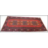 A hand knotted woolen Herati Baluchi carpet floor rug, central panel with traditional motif and