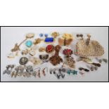 A collection of vintage 20th Century costume jewellery brooches to include a Scottish Grouse foot