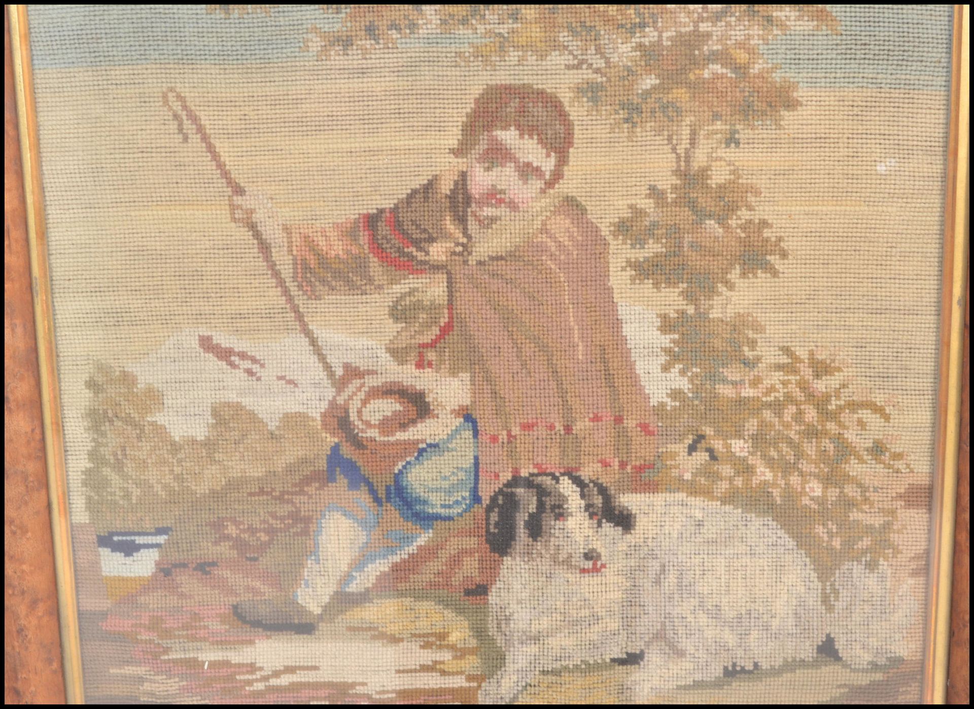A 19th Century needlepoint tapestry framed picture depicting a shepherd boy with a dog seated - Bild 2 aus 4