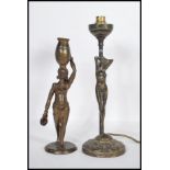 Two 20th Century cast bronze table lamps to in the form of female figures to include an African