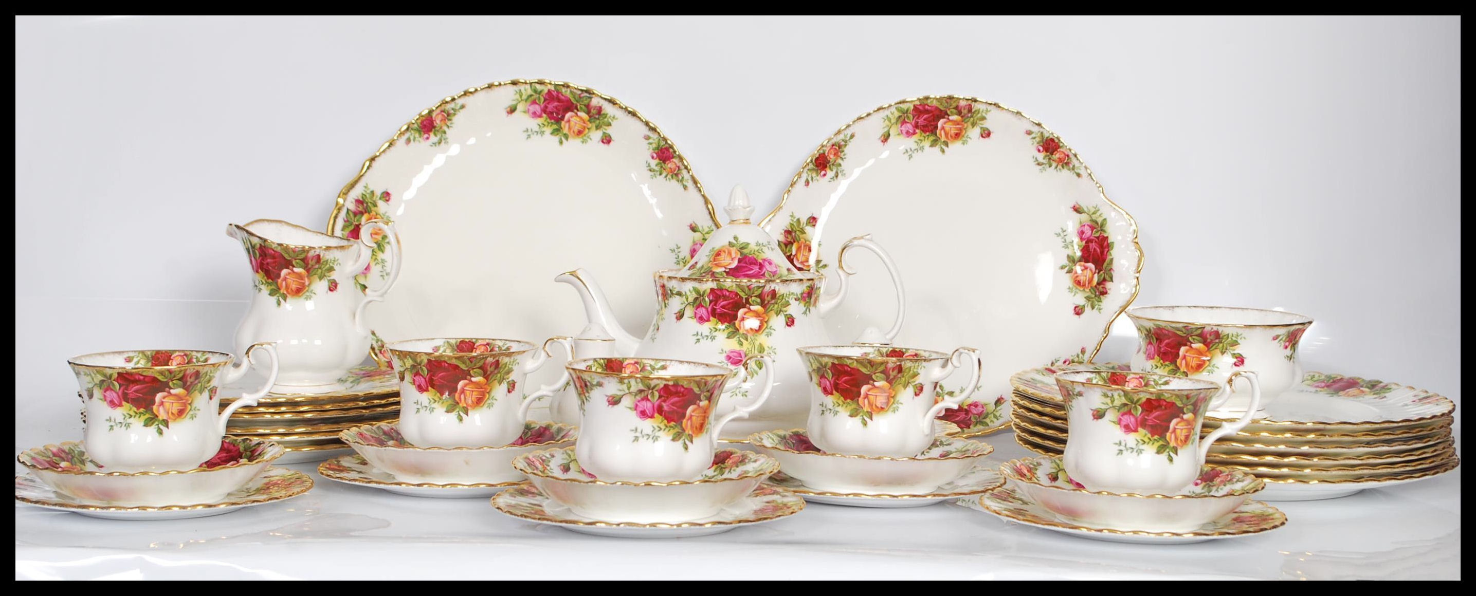 A Royal Albert bone China dinner / tea service in the Country Roses pattern. Consisting of dinner