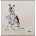 A stamped 925 sterling silver pin cushion in the form of a kangaroo having a red velvet pincushion