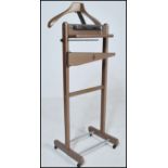 A mid 20th Century gentleman's valet stand having original markings 'The Versatile Valet Made in