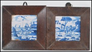 Two 18th Century Delft blue and white hand painted tiles both picturing narrative scenes, one
