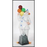 A Royal Doulton ceramic figurine of a Circus clown titled ' Balloon Clown ', No HN2894, dated