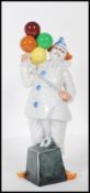 A Royal Doulton ceramic figurine of a Circus clown titled ' Balloon Clown ', No HN2894, dated