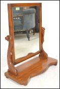 A 19th Century Victorian mahogany dressing table swing mirror of  arch form, raised on shaped base