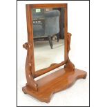 A 19th Century Victorian mahogany dressing table swing mirror of  arch form, raised on shaped base