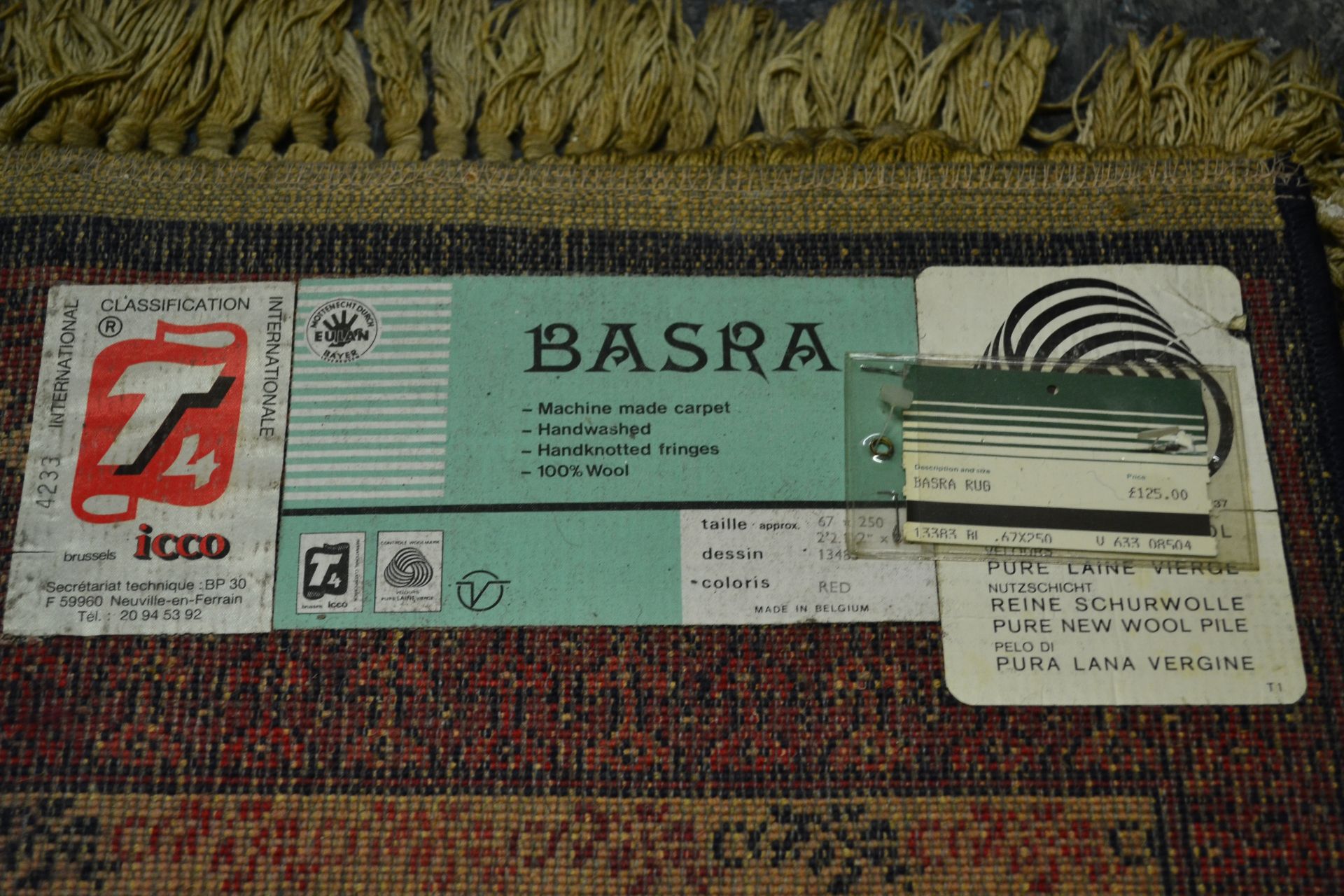 A Belgian Made ' Basra ' Tassled 'wool rug floor runner on red ground, central design of geometric - Bild 4 aus 4
