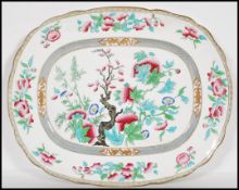 A large 19th Century ceramic centrepiece meat platter in the indian tree pattern, transfer printed