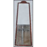 A 1920/ 30's Japanned full length wall mirror having a red lacquered frame with an applied carved
