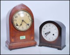 Two 20th Century mantel clocks to include an Edwardian wooden cased mantel clock with satin wood