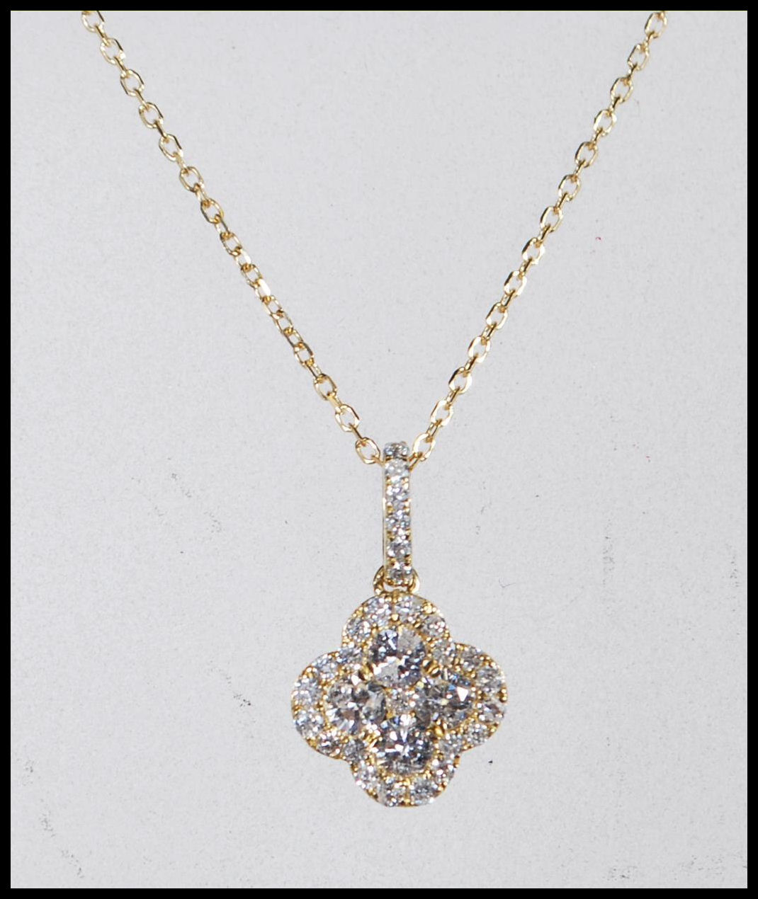 A hallmarked 18ct yellow gold necklace having a pendant in the form of a four leaf clover set with - Image 3 of 6
