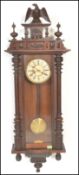 A 19th Century Victorian walnut cased Vienna regulator wall clock in the manner of Gustav Becker,