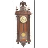 A 19th Century Victorian walnut cased Vienna regulator wall clock in the manner of Gustav Becker,