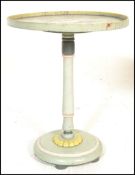 A late 19th / early 20th Century satinwood round painted centre table on round column and circular