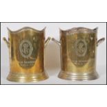 A good pair of early 20th century silver plated champagne ice buckets. Both marked to front '