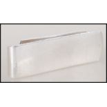 A silver hallmarked contemporary Gucci money clip, inscribed Gucci to the top panel designed with