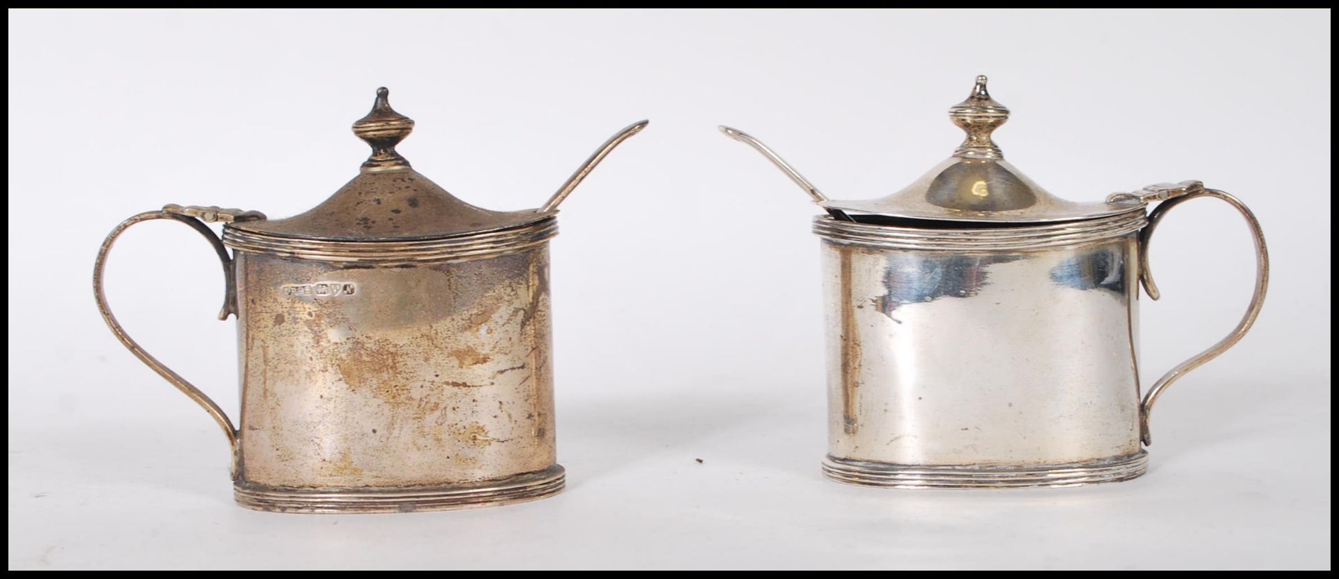 A pair of Zachariah Barraclough & Sons lidded mustard condiments of ovular form having hinged lid