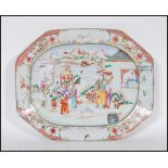 A 18th Century circa 1780 Qing Dynasty famille rose serving platter plate depicting a court yared