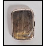 An Art Deco silver hallmarked cigarette case of rectangular bowed form with engine turned stripe