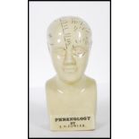 A 20th Century desk top phrenology head ornament of small proportions having printed annotations.