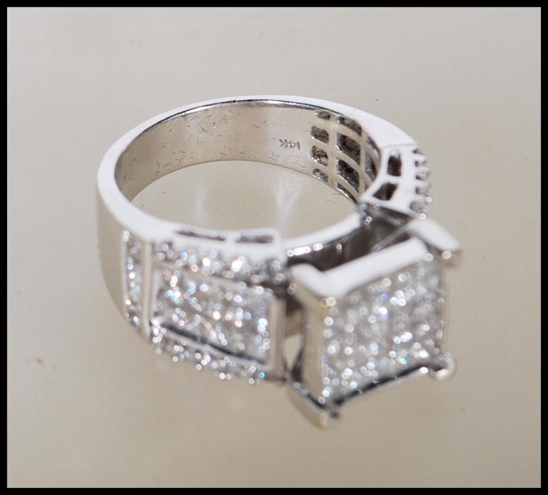 A stamped 14ct white gold and diamond ring. The head having a pave set of diamonds on a suspended - Bild 5 aus 5