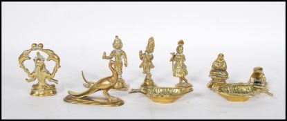 A collection of 20th Century cast bronze Chinese and asiatic figurines, many modelled as deities,