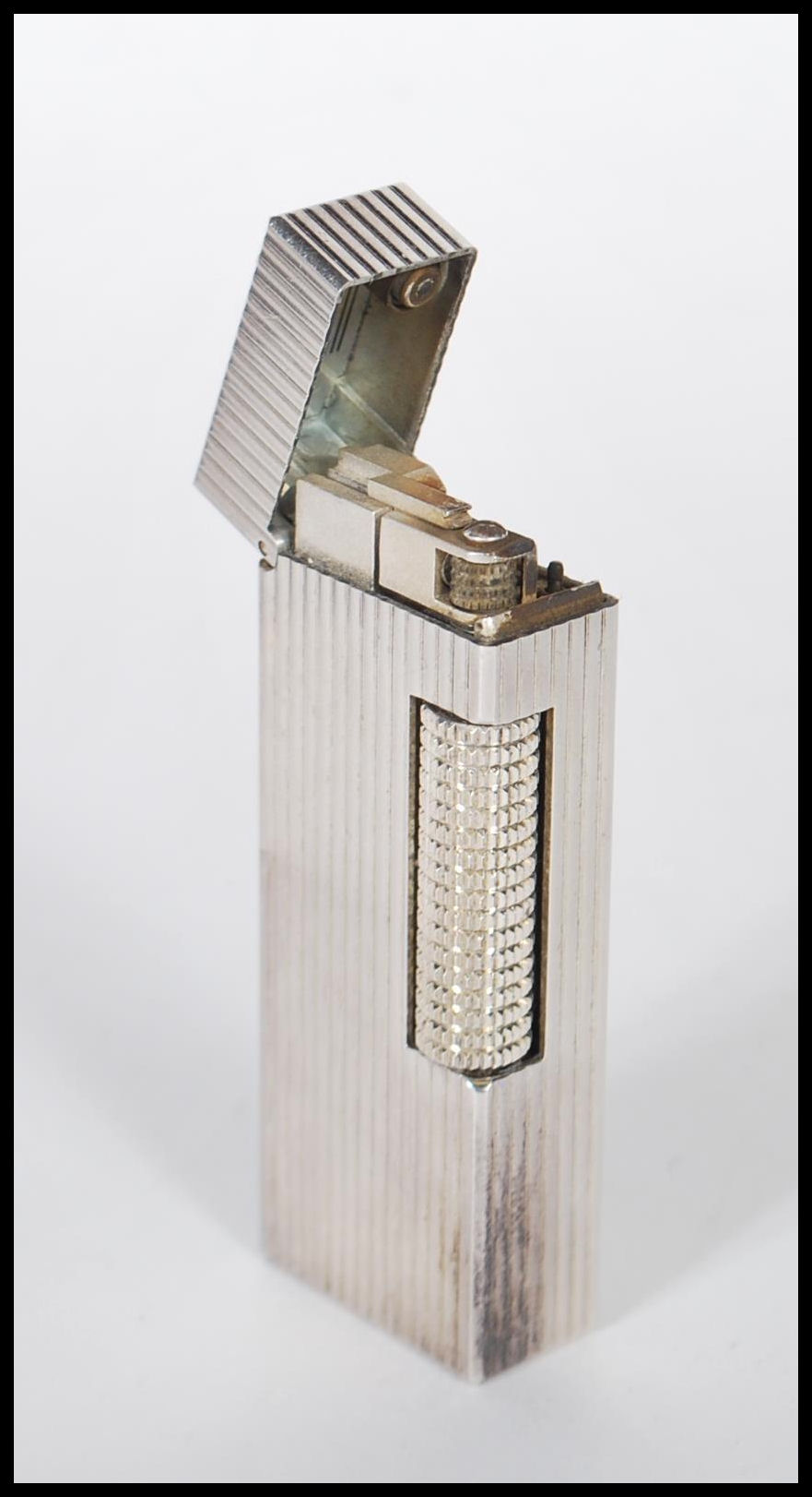 A vintage mid 20th Century Dunhill white metal rollagas lighter of reeded form, within original - Image 2 of 5