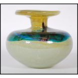 A vintage studio yellow and turquoise swirl glass Mdina vase of squat bulbous form having a flared