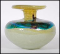 A vintage studio yellow and turquoise swirl glass Mdina vase of squat bulbous form having a flared