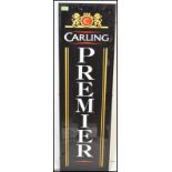 An upright advertising light box for ' Carling Premier ' having a perspex front with mounted back.