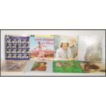 A collection of vinyl long play LP vinyl record albums from various artists to include The Beatles A