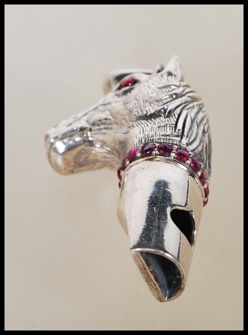 A silver novelty whistle pendant in the form of a horse head set with ruby eyes and having a ruby - Image 3 of 6