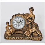 A contemporary gilt Juliana figural pendulum quartz clock, the barrel style movement flanked by a