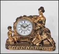 A contemporary gilt Juliana figural pendulum quartz clock, the barrel style movement flanked by a