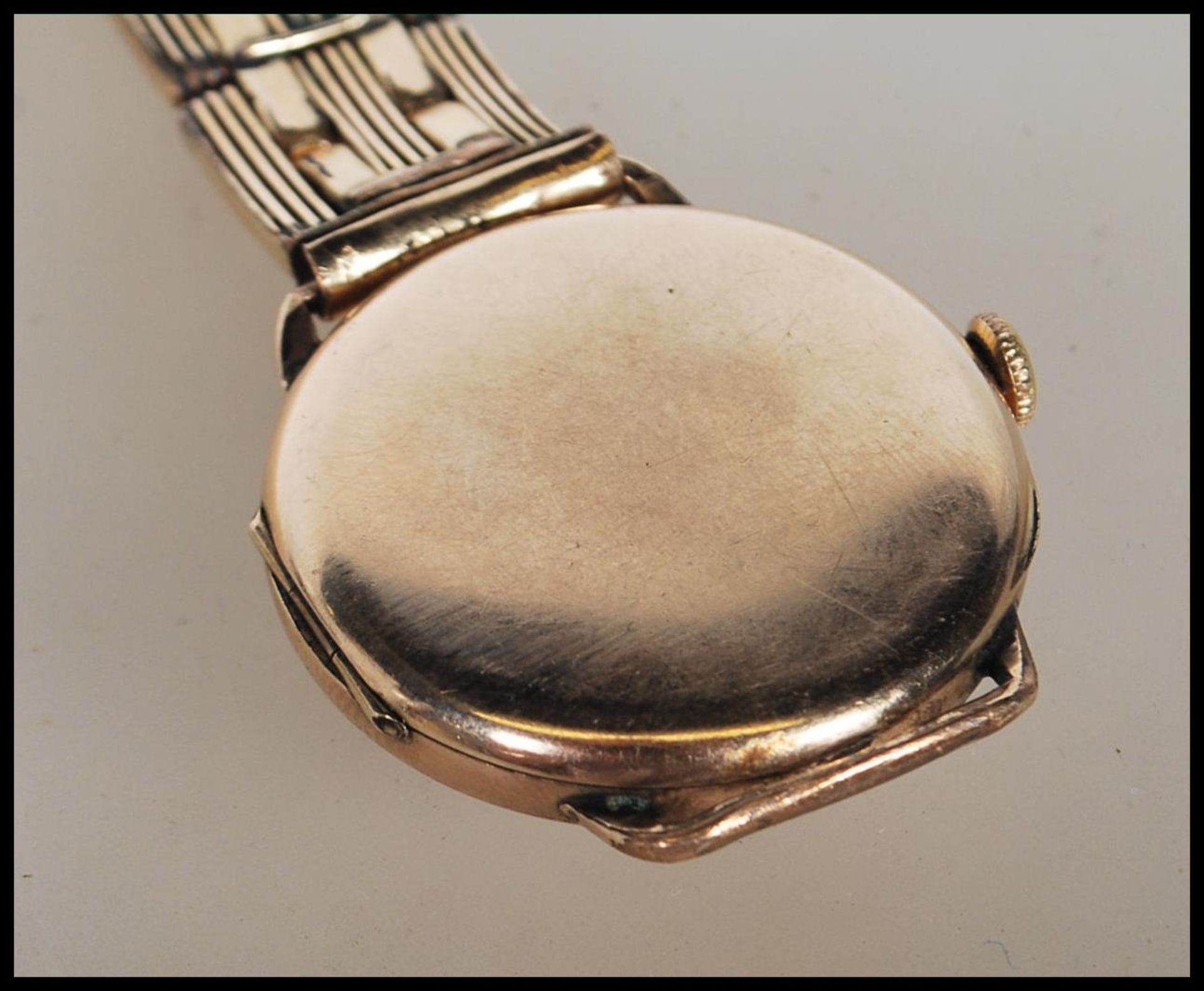 A vintage 1930's 15 jewels Omega gentleman's gold plated wrist watch having a round gilt face with - Bild 4 aus 7