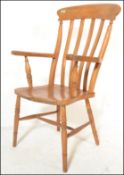 A 19th Century Victorian elm and beechwood Windsor farmhouse elbow chair, lath back above out