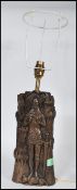A vintage 20th Century stylized bronzed table lamp modelled as a Norman Knight / Knight Templar