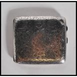 A silver hallmarked cigarette case, chase decorated design with Birmingham assay, makers mark for