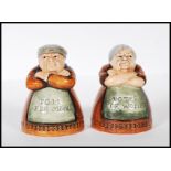 A pair of later 20th Century Royal Doulton reissue salt and pepper pots modelled as a lady and