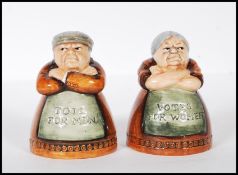 A pair of later 20th Century Royal Doulton reissue salt and pepper pots modelled as a lady and