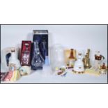 A collection of Bell's Scotch Whisky related advertising items to include Bell's bell decanters (one
