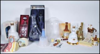 A collection of Bell's Scotch Whisky related advertising items to include Bell's bell decanters (one