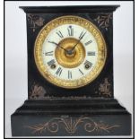 An antique late 19th / early 20th century Victorian slate mantel clock. The dial being enamel,