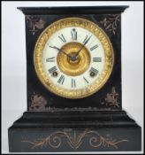 An antique late 19th / early 20th century Victorian slate mantel clock. The dial being enamel,