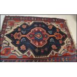 A 20th Century Persian Islamic multi coloured Kelim / Kilim woven floor rug having central medalon