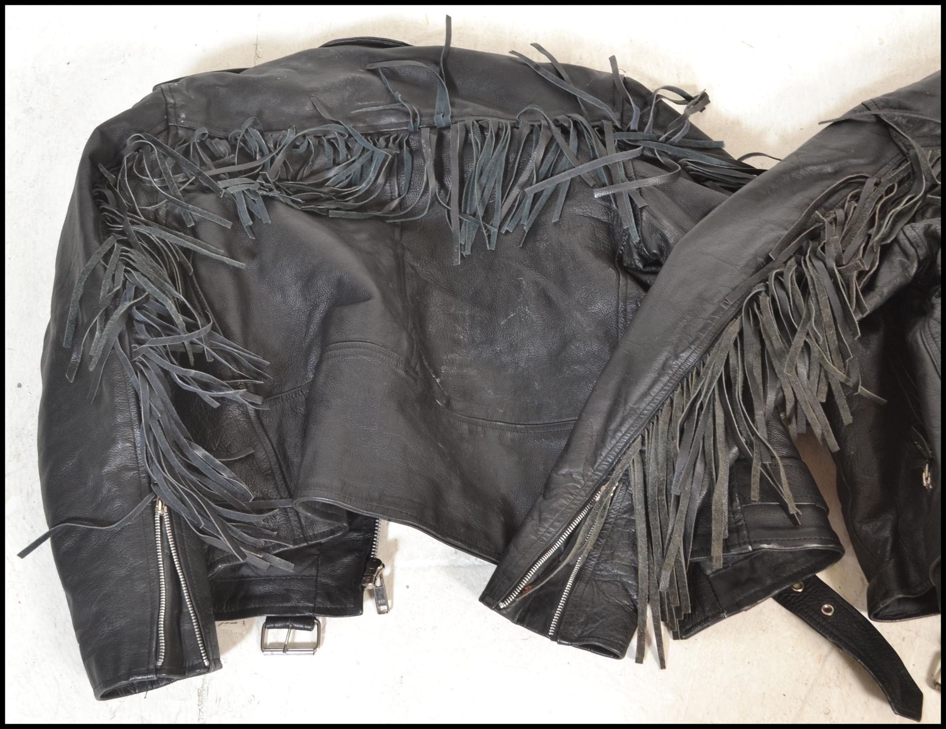 Two leather jackets both having tassels to the arms and backs with one having tassels to the - Bild 6 aus 7